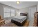 Neutral bedroom featuring a king size bed, large window, and decorative rug at 1012 Autumn Meadow Ln, Wake Forest, NC 27587