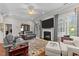 Spacious living room featuring a fireplace, neutral furniture and natural light at 1012 Autumn Meadow Ln, Wake Forest, NC 27587