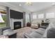 Inviting living room features a fireplace, plush couches, and plenty of natural light at 1012 Autumn Meadow Ln, Wake Forest, NC 27587