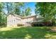 Expansive backyard featuring a multi-level deck and lush lawn, ideal for outdoor entertaining and relaxation at 1015 Manchester Dr, Cary, NC 27511