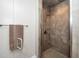 Tiled shower with glass doors and neutral walls, showcasing bathroom features at 1015 Manchester Dr, Cary, NC 27511