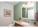 Stylish half bath with shiplap accent wall, granite counter, and modern lighting at 1015 Manchester Dr, Cary, NC 27511
