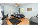 This carpetless bedroom has natural light and a ceiling fan at 1015 Manchester Dr, Cary, NC 27511
