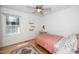 A carpetless bedroom with a ceiling fan and hanging shelves at 1015 Manchester Dr, Cary, NC 27511