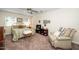 Relaxing bedroom with a comfortable bed, ceiling fan, and a cozy sitting area at 1015 Manchester Dr, Cary, NC 27511