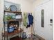 Charming foyer with coat rack, shelf decor, and tiled flooring near the front door at 1015 Manchester Dr, Cary, NC 27511