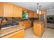 Spacious kitchen with maple cabinets, granite countertops, stainless steel appliances, and tile backsplash at 1015 Manchester Dr, Cary, NC 27511