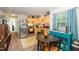 Well-lit kitchen with stainless steel appliances, wood cabinets, and breakfast table at 1015 Manchester Dr, Cary, NC 27511