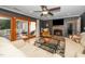Bright living room with a fireplace, and sliding glass doors that lead to an outdoor deck at 1015 Manchester Dr, Cary, NC 27511