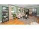 Bright and inviting living room featuring hardwood floors, neutral decor, and a stylish coffee table at 1015 Manchester Dr, Cary, NC 27511