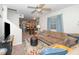 Spacious living room open to the kitchen featuring a ceiling fan and comfortable seating at 1015 Manchester Dr, Cary, NC 27511