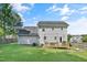 Exterior of home with a large, fenced backyard and a wooden deck for outdoor enjoyment at 105 Tactical Dr, Bunnlevel, NC 28323