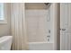 Bathroom shower/tub combination with neutral shower curtain at 105 Tactical Dr, Bunnlevel, NC 28323
