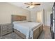 Comfortable bedroom with soft carpeting, neutral paint, a ceiling fan, and natural light at 105 Tactical Dr, Bunnlevel, NC 28323