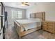 Comfortable bedroom with soft carpeting, neutral paint, a ceiling fan, and natural light at 105 Tactical Dr, Bunnlevel, NC 28323