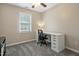 Bedroom featuring modern desk, soft carpet, neutral paint, a ceiling fan, and natural light at 105 Tactical Dr, Bunnlevel, NC 28323
