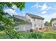 Back exterior of the home featuring a well-manicured lawn and a wooden deck at 105 Tactical Dr, Bunnlevel, NC 28323