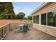Back deck with green chairs with a view of the surrounding landscape at 111 Gingergate Dr, Cary, NC 27519