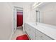 Bright bathroom featuring a long vanity with a large mirror and a doorway to the shower and toilet at 111 Gingergate Dr, Cary, NC 27519