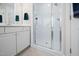Bathroom with tiled floors, updated vanity, and a glass-enclosed shower at 111 Gingergate Dr, Cary, NC 27519