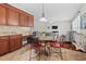 Cozy dining area sits between kitchen and living room with hardwood floors at 111 Gingergate Dr, Cary, NC 27519