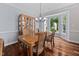 Charming dining room with hardwood floors, chandelier and bay window for natural light at 111 Gingergate Dr, Cary, NC 27519