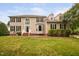 Charming two-story home boasts manicured lawn, dormer windows, and classic architectural details at 111 Gingergate Dr, Cary, NC 27519