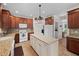 Bright kitchen showcases an island, granite countertops, and plenty of cabinet space at 111 Gingergate Dr, Cary, NC 27519