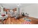Open-concept living room connects to kitchen with hardwood floors at 111 Gingergate Dr, Cary, NC 27519