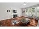 Bright living room with fireplace and large windows at 111 Gingergate Dr, Cary, NC 27519