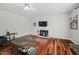 Inviting living room features hardwood floors, fireplace, and ceiling fan at 111 Gingergate Dr, Cary, NC 27519