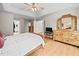 Main bedroom features a tray ceiling, ceiling fan, and an ensuite bath at 111 Gingergate Dr, Cary, NC 27519