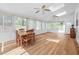 Bright sun room featuring skylights, ceiling fans and hardwood floors at 111 Gingergate Dr, Cary, NC 27519
