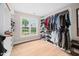 Large walk-in closet includes custom shelving, storage, and a window at 111 Gingergate Dr, Cary, NC 27519