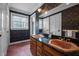 Charming bathroom with double vanity, vintage sinks, and patterned wallpaper at 12088 Burlington Rd, Hurdle Mills, NC 27541