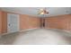 Spacious bedroom with carpet, fan, and neutral paint, offering a bright and comfortable space at 12088 Burlington Rd, Hurdle Mills, NC 27541
