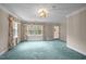 Bedroom featuring bright light, plush carpeting and large window at 12088 Burlington Rd, Hurdle Mills, NC 27541