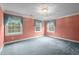 Charming bedroom with three windows and a light fixture at 12088 Burlington Rd, Hurdle Mills, NC 27541
