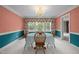 Cozy dining room featuring colorful decor, chandelier lighting, and a large window at 12088 Burlington Rd, Hurdle Mills, NC 27541