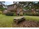 Charming multi-story home with a spacious backyard and a picnic table, perfect for outdoor entertaining at 12088 Burlington Rd, Hurdle Mills, NC 27541