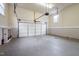 Garage featuring concrete floor and white garage door at 12088 Burlington Rd, Hurdle Mills, NC 27541