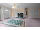 Spacious living room with decorative fireplace and large front door with decorative sidelights at 12088 Burlington Rd, Hurdle Mills, NC 27541