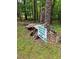 Trail marker directing to the firewood trail and the parking lot, surrounded by trees at 12088 Burlington Rd, Hurdle Mills, NC 27541