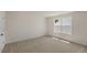 Bedroom with neutral walls, carpet and a window offering natural light at 121 Gilmer St, Fuquay Varina, NC 27526