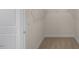A walk-in closet with wire shelving and plush carpet at 121 Gilmer St, Fuquay Varina, NC 27526