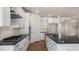 Modern kitchen featuring stainless steel appliances, white cabinets, and dark countertops at 121 Gilmer St, Fuquay Varina, NC 27526