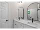 Bright bathroom featuring a double vanity with marble countertop and modern black fixtures at 12301 Hardee Rd, Raleigh, NC 27614
