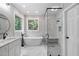 Beautiful bathroom with a soaking tub, tiled shower, double vanity, and modern fixtures at 12301 Hardee Rd, Raleigh, NC 27614
