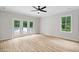 Bedroom featuring a ceiling fan, backyard views, and access to the outdoor deck at 12301 Hardee Rd, Raleigh, NC 27614