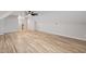 Spacious bonus room featuring hardwood floors and a modern ceiling fan at 12301 Hardee Rd, Raleigh, NC 27614